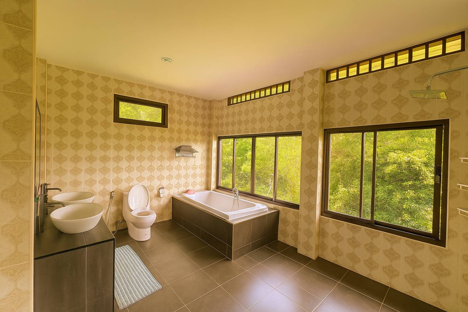 Eco-friendly ensuite bathroom with rain shower – Canopy Residence